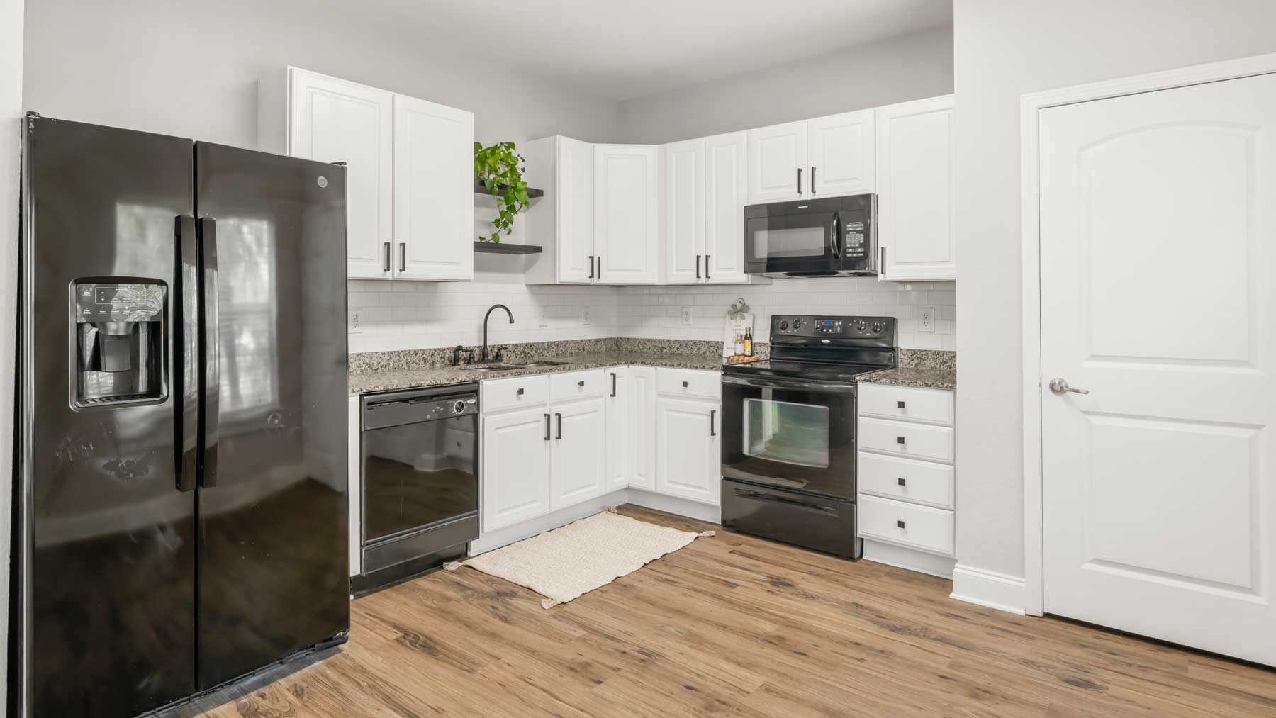 Spacious kitchen with pantry in Warner Series apartment